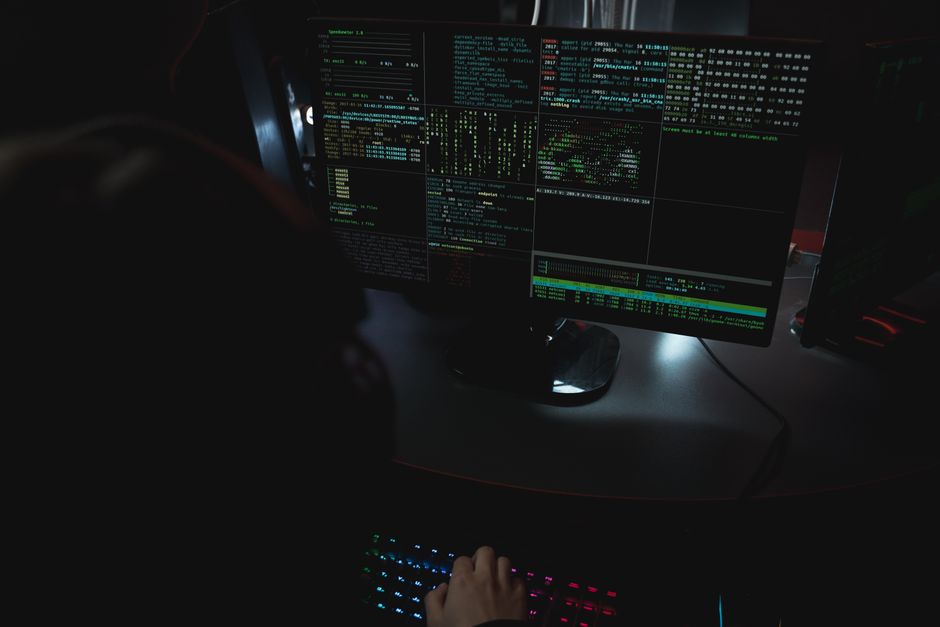 Close-up of a dark computer screen displaying abstract digital glitch art, symbolizing the disruption of traditional search.