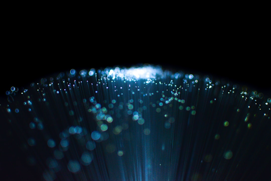 An abstract digital visualization of a glowing blue network of interconnected nodes, representing a streamlined and unified AI-driven data pipeline.