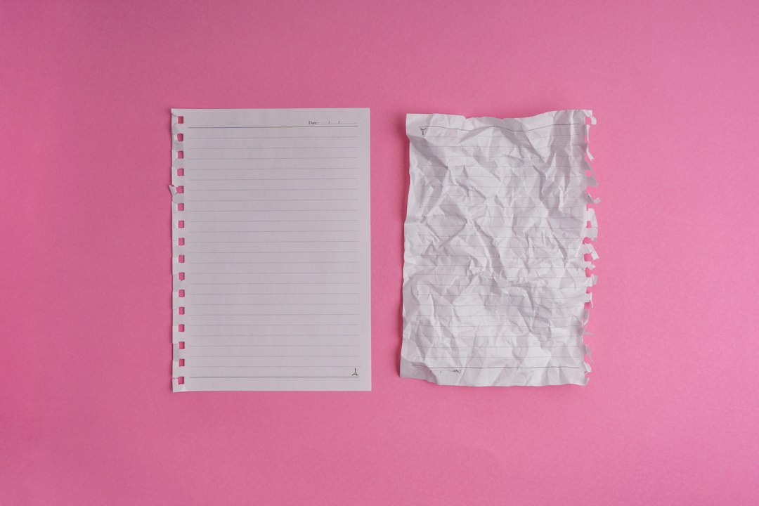 A large, stark pile of crumpled white paper on a minimal background, illustrating the concept of digital waste and disposable content.