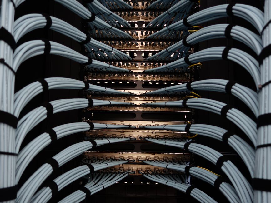 A long perspective shot down a clean, modern server room aisle, illustrating the new, organized, and powerful playbook for instant content indexing.