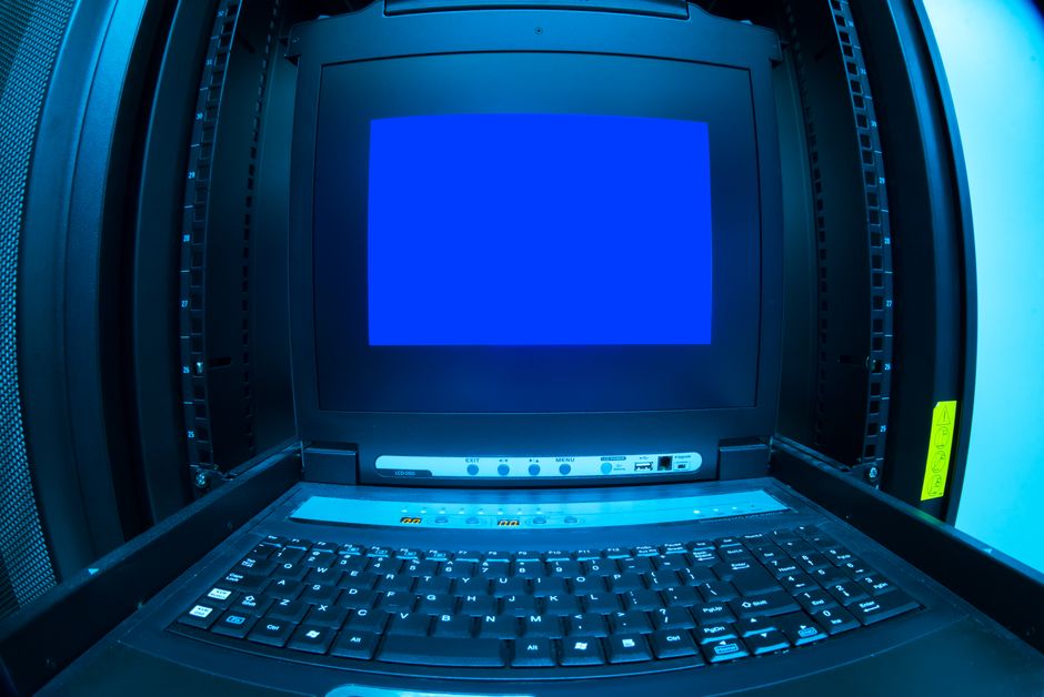 Sleek, modern data center with rows of server racks illuminated by glowing blue lights, symbolizing cloud infrastructure a...